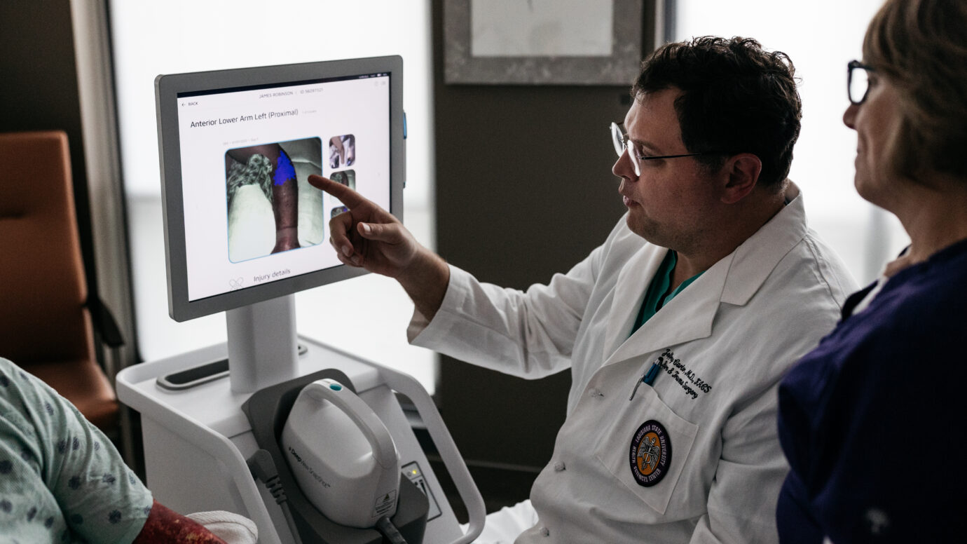 Doctor looking at screen imaging